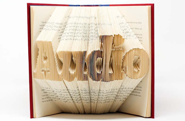 Paper book art, pages folded to form the word audio.