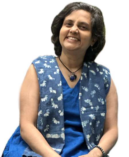 Susmitha, vegan expert coach, wearing a blue dress and smiling wide.