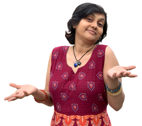 Susmitha Veganosaurus. Short haired Indian vegan lady in red dress. Shrugging. Wearing deep blue, black, and pink cryatal pendants.